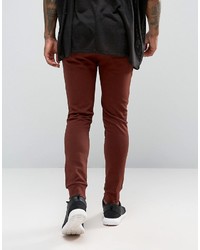 Asos Super Skinny Joggers With Knee Rips In Dark Red
