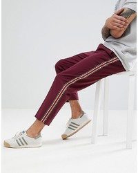 ASOS DESIGN Tapered Trousers In Burgundy With Tape