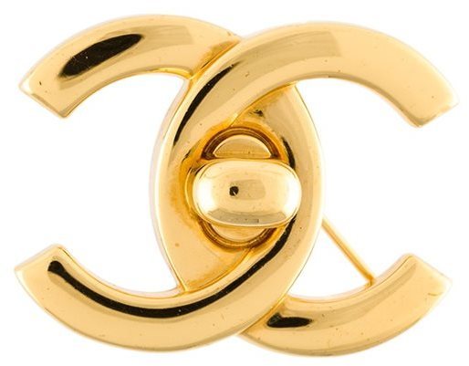 Chanel Vintage Turn Lock Logo Brooch, $600, farfetch.com