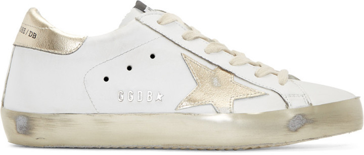 white and gold golden goose