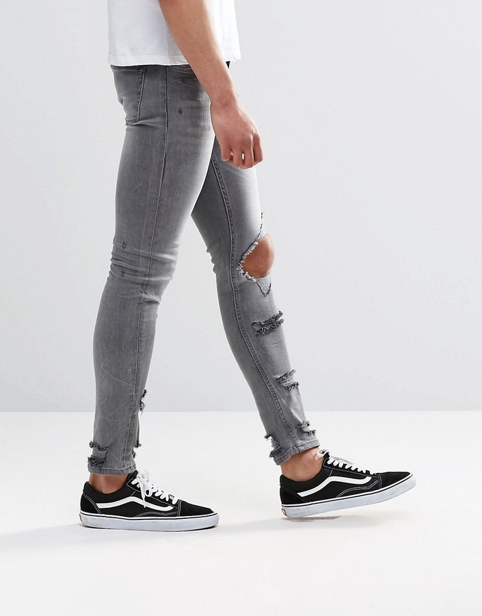https://cdn.lookastic.com/grey-ripped-skinny-jeans/extreme-super-skinny-jeans-with-mega-rips-in-gray-1765167-original.jpg