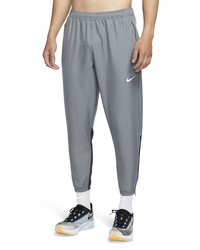 Nike Dri Fit Essential Woven Pocket Running Pants