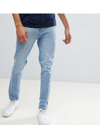 Asos Design Tall Skinny Twisted Seam Jeans In Light Wash Blue With Abrasions