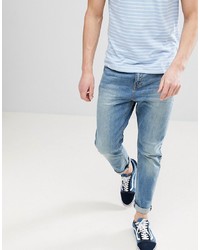 ASOS DESIGN Tapered Jeans In Mid Wash