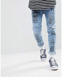 ASOS DESIGN Skinny Jeans In Mid Wash Blue With All Over Grunge