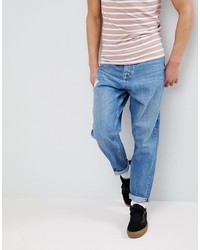 ASOS DESIGN Asos Oversized Tapered Jeans In Mid Wash With Rip