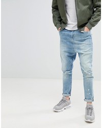 ASOS DESIGN Drop Crotch Jeans In Mid Wash Blue With Rips
