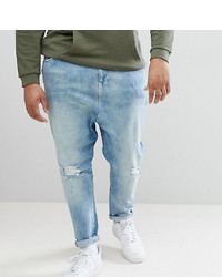 ASOS DESIGN Plus Drop Crotch Jeans In Mid Wash Blue With Rips