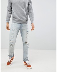 ASOS DESIGN Slim Jeans In Light Wash Blue With Heavy Rips