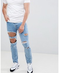 ASOS DESIGN Slim Jeans In Mid Wash Blue With Heavy Rips