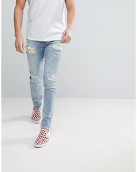 ASOS DESIGN Asos Skinny Jeans In Light Wash Blue With Heavy Rips