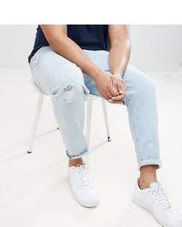ASOS DESIGN Plus Tapered Jeans In Light Wash Blue With Abrasions