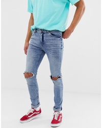 Cheap Monday Skinny Jeans With Knee Rips In Blue