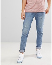 ASOS DESIGN Super Skinny Jeans In Vintage Mid Wash With Rip And Repair