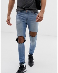 ASOS DESIGN Super Spray On Jeans In Light Blue With Open Rips