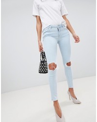 ASOS DESIGN Whitby Low Rise Skinny Jeans In Philoa Light Ice Stone Wash With Busted Knees