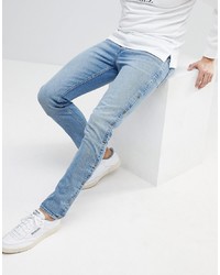 ASOS DESIGN Asos Skinny Jeans In Mid Wash Blue With Popper Detail