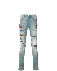 Amiri Distressed Skinny Jeans With Patch Appliqus