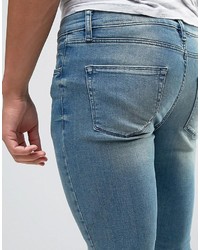 Asos Extreme Super Skinny Jeans With Abrasions In Mid Blue