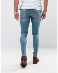 Asos Extreme Super Skinny Jeans With Abrasions In Mid Blue