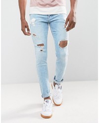 Asos Skinny Jeans In Light Wash Blue With Heavy Rips