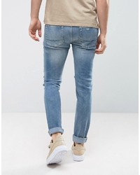 Asos Skinny Jeans In Vintage Mid Wash Blue With Heavy Rips