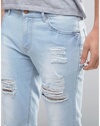 Asos Skinny Jeans With Heavy Rips In Bleach Wash Blue