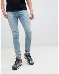 ASOS DESIGN Super Skinny Jeans In Mid Wash Blue