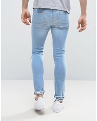 Asos Super Skinny Jeans With Zip Knee Rips In Bleach Blue