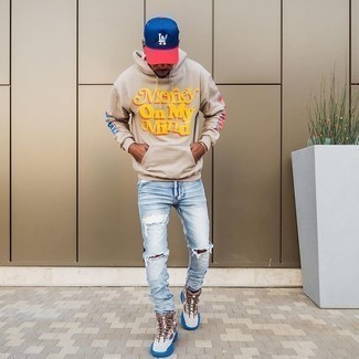 Men's Navy and Red Baseball Cap, Brown Athletic Shoes, Light Blue Ripped Jeans, Beige Print Hoodie