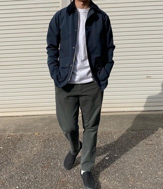 Navy Barn Jacket Outfits: A navy barn jacket and dark green chinos are wonderful menswear essentials that will integrate perfectly within your casual styling rotation. A pair of black canvas slip-on sneakers will tie this whole look together.
