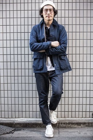 Navy Barn Jacket Outfits: A navy barn jacket and navy jeans married together are the ideal outfit for guys who prefer casual and cool getups. Let your styling chops truly shine by complementing this ensemble with a pair of white canvas low top sneakers.