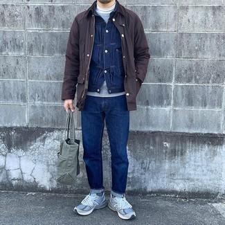 1200+ Chill Weather Outfits For Men: Extra dapper, this relaxed combination of a dark brown barn jacket and navy jeans offers amazing styling opportunities. Let your styling sensibilities really shine by rounding off this ensemble with grey athletic shoes.