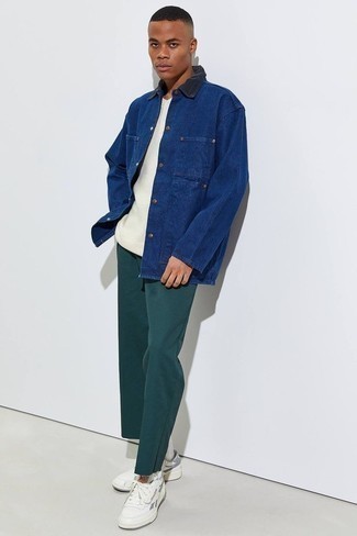 Men's Outfits 2022: The pairing of a navy barn jacket and dark green chinos makes this a neat laid-back ensemble. Finishing off with white leather low top sneakers is a fail-safe way to inject a more laid-back touch into this outfit.