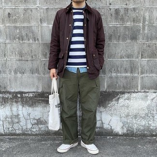 Men's Outfits 2021: If it's ease and functionality that you're looking for in a look, opt for a dark brown barn jacket and olive cargo pants. A pair of white canvas low top sneakers is a good option to complete this ensemble.