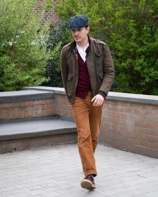 Tobacco Jeans Outfits For Men: Effortlessly blurring the line between cool and laid-back, this combo of a dark brown barn jacket and tobacco jeans is bound to become one of your favorites. A pair of burgundy leather low top sneakers will be the ideal complement for your look.