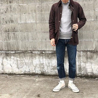 Dark Brown Barn Jacket Outfits: If you prefer casual style, why not take this combo of a dark brown barn jacket and navy jeans for a spin? White canvas low top sneakers are a stylish companion for your getup.