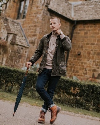Brown Leather Work Boots Outfits For Men: The versatility of an olive barn jacket and navy jeans guarantees they will stay on permanent rotation. Balance out this getup with a more laid-back kind of footwear, like these brown leather work boots.
