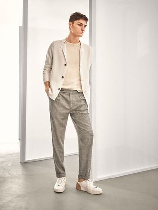 Grey Chinos Outfits: When the setting calls for a casually smart look, you can easily opt for a beige knit blazer and grey chinos. Feeling brave today? Jazz up this ensemble with a pair of white canvas low top sneakers.