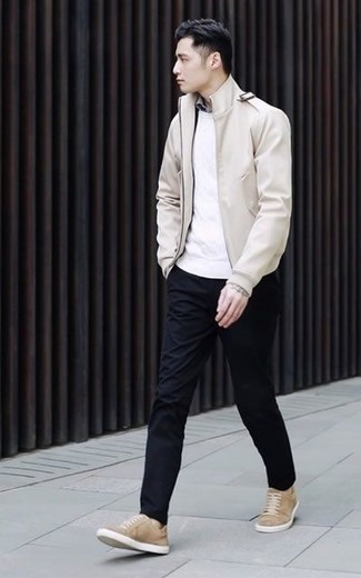 Beige Canvas Low Top Sneakers Outfits For Men: Pairing a beige leather bomber jacket with black chinos is an awesome pick for an off-duty but seriously stylish ensemble. And if you need to easily dress down your getup with one item, complement this getup with a pair of beige canvas low top sneakers.