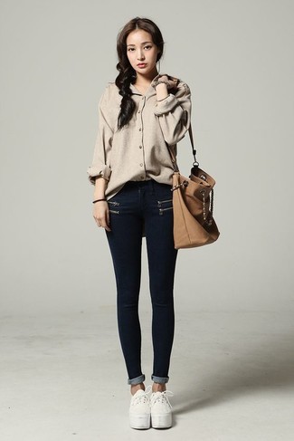 Women's Beige Button Down Blouse, Black Skinny Jeans, White Plimsolls, Tan Leather Bucket Bag