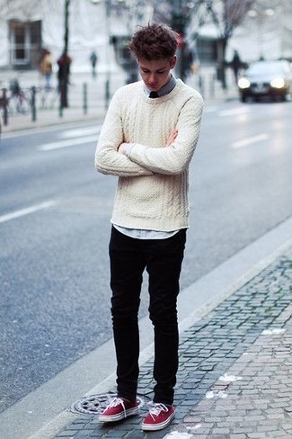 Red Plimsolls Outfits For Men: This casual combination of a beige cable sweater and black jeans is perfect when you need to look casual and cool in a flash. Red plimsolls are a stylish companion for this getup.