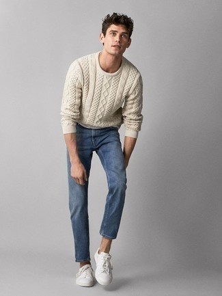 Beige Cable Sweater Outfits For Men: If you're a fan of classic combos, then you'll like this combination of a beige cable sweater and blue jeans. Let your sartorial expertise really shine by rounding off your ensemble with a pair of white canvas low top sneakers.