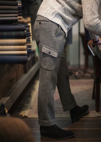 Grey Cargo Pants Outfits: This combo of a beige cable sweater and grey cargo pants makes for the ultimate casual style for today's gentleman. You can get a bit experimental when it comes to shoes and throw in black suede desert boots.
