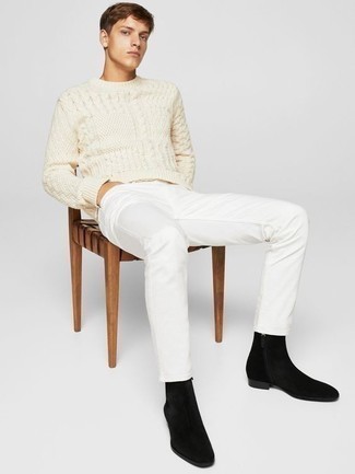 Black Suede Chelsea Boots Outfits For Men: This pairing of a beige cable sweater and white jeans resonates versatility and casual menswear style. To give your overall ensemble a classier feel, add a pair of black suede chelsea boots to the mix.