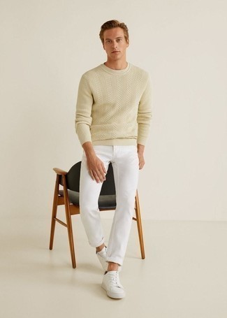 Beige Cable Sweater Outfits For Men: Reach for a beige cable sweater and white jeans for a comfortable getup that's also put together. This ensemble is rounded off wonderfully with a pair of white leather low top sneakers.