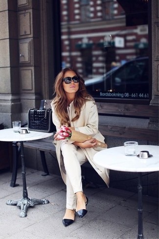 Camel Coat Outfits For Women: For comfort dressing with a chic twist, you can dress in a camel coat and white skinny jeans. Add black leather ballerina shoes to your look to have some fun with things.