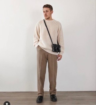 Black Leather Messenger Bag Outfits: A beige crew-neck sweater and a black leather messenger bag make for the ultimate casual look for today's gent. Black leather chelsea boots are guaranteed to give a touch of polish to this ensemble.