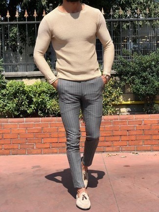Charcoal Vertical Striped Chinos Outfits: The versatility of a beige crew-neck sweater and charcoal vertical striped chinos ensures they'll stay on high rotation in your closet. Finishing off with beige suede tassel loafers is an effortless way to infuse an air of class into this outfit.