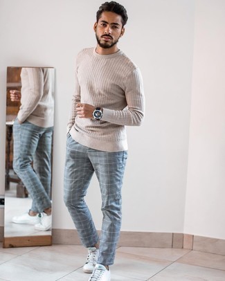 White Leather Low Top Sneakers Outfits For Men: A beige crew-neck sweater and grey plaid chinos are absolute menswear essentials if you're crafting an off-duty wardrobe that matches up to the highest style standards. For extra style points, complement this ensemble with a pair of white leather low top sneakers.